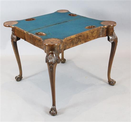 A fine George I figured walnut card table, W.2ft 10in. D.1ft 5in. H.2ft 5in.